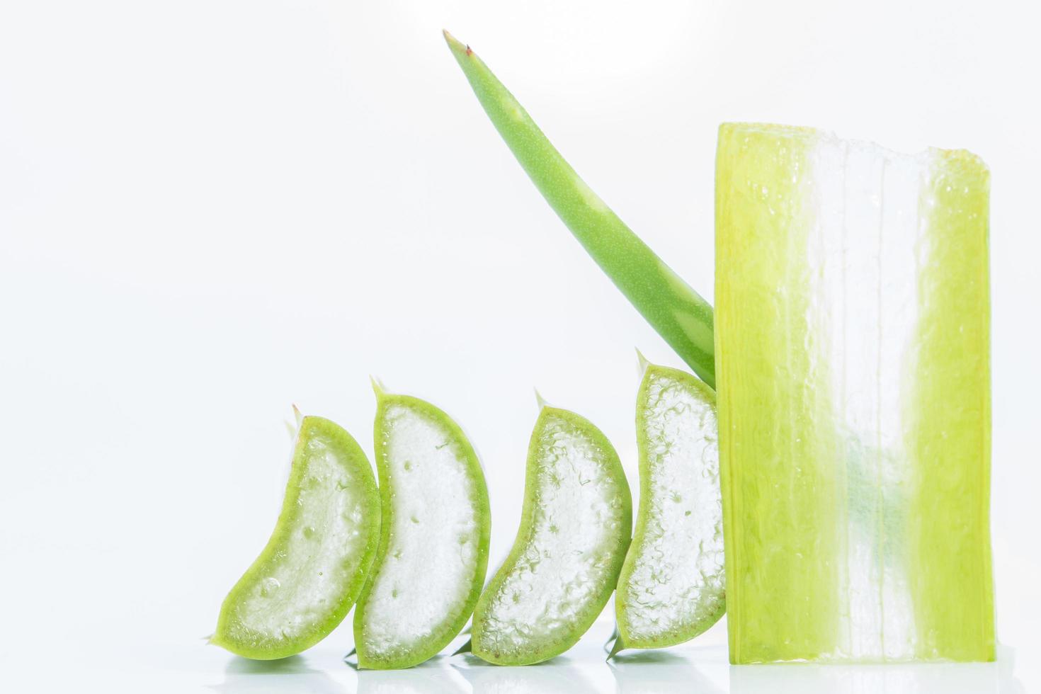 Sliced aloe vera on white background photo