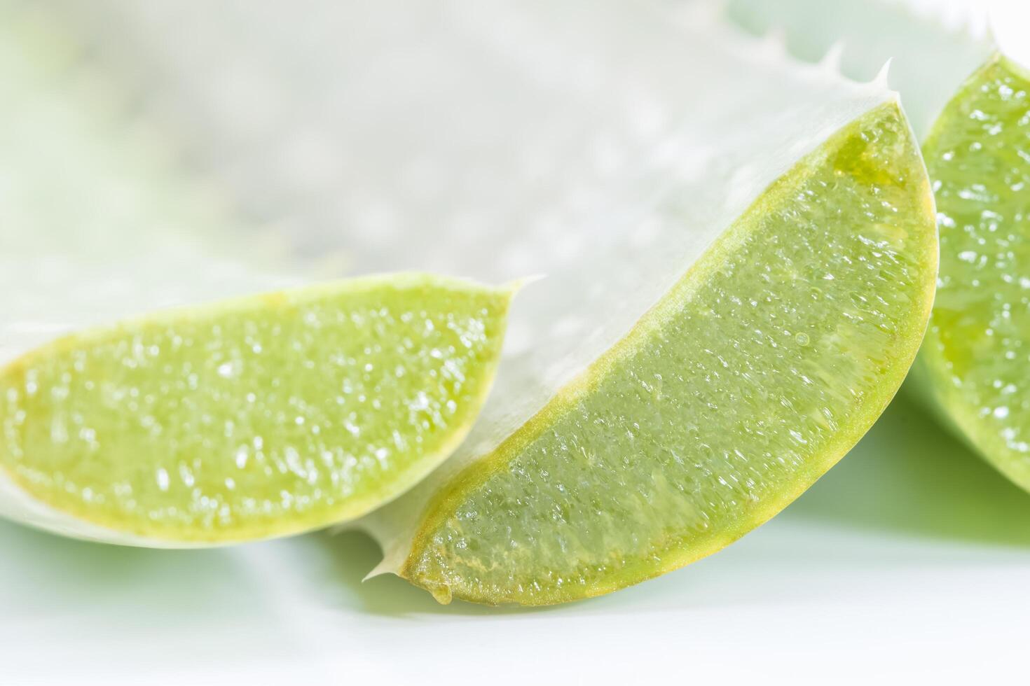 Sliced aloe vera on white background photo