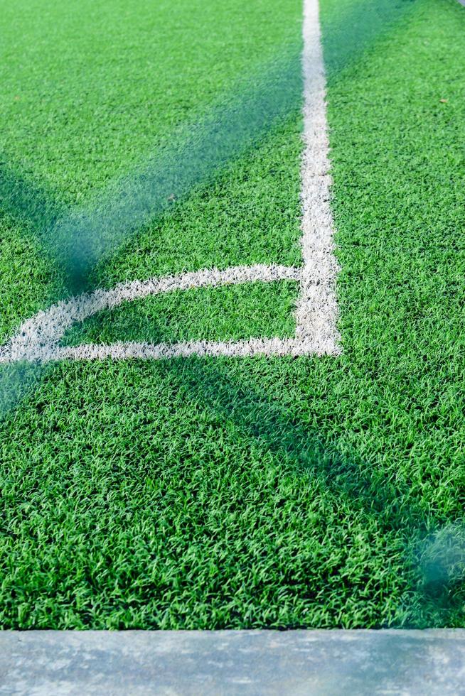 Artificial turf football field corner photo