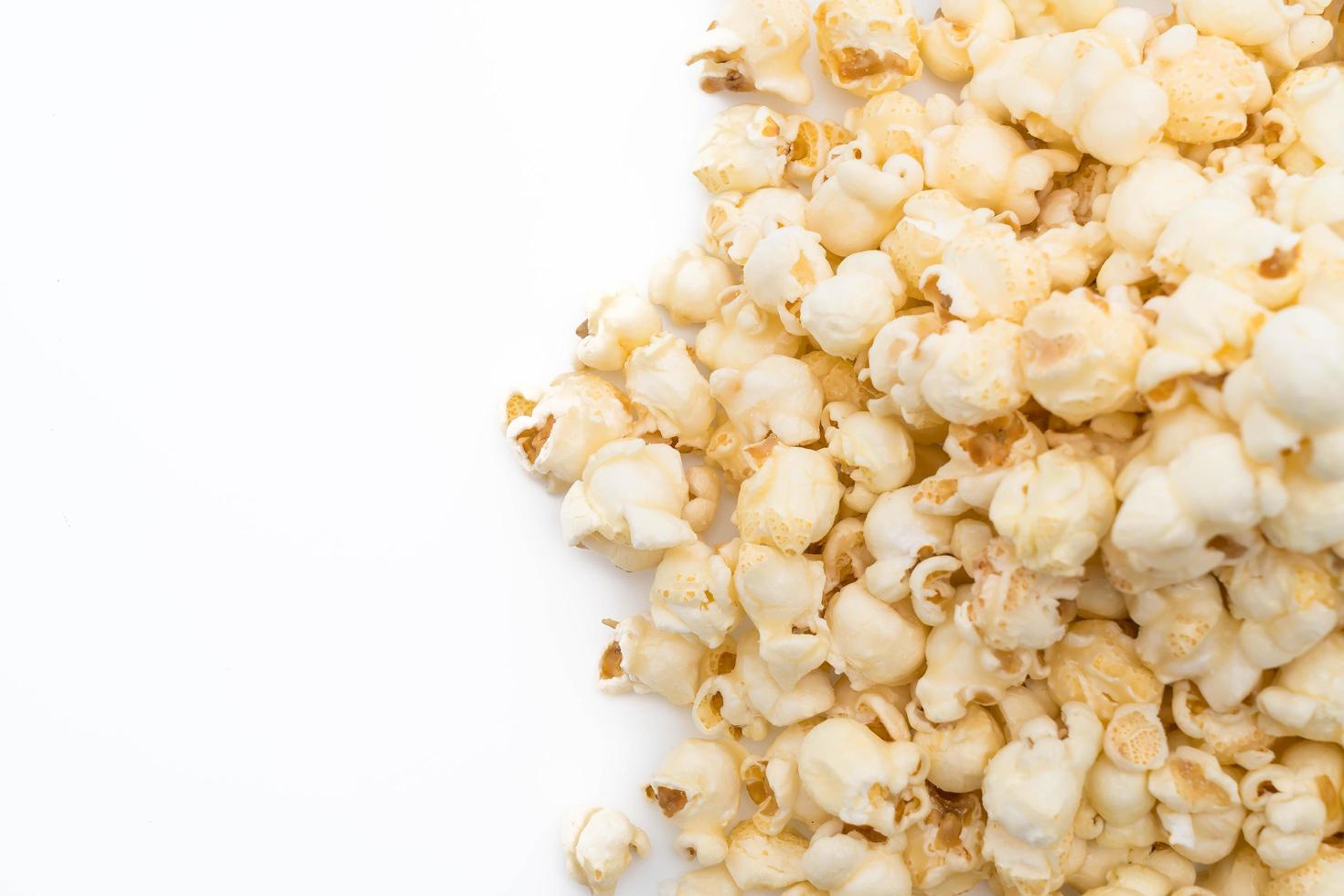 Caramel popcorn on white background photo