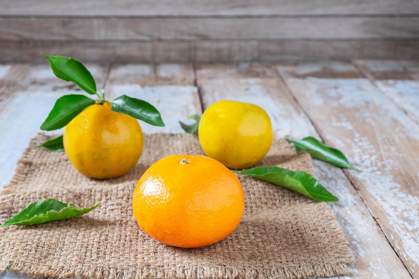 Orange fruit on wooden table photo