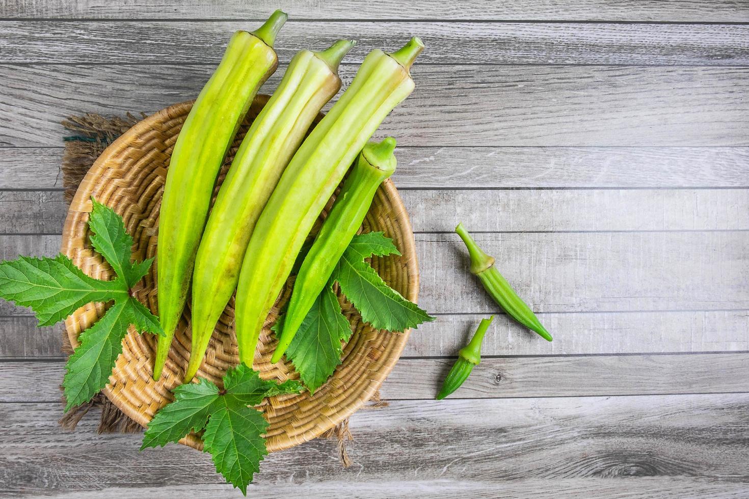 Raw okra in basket photo