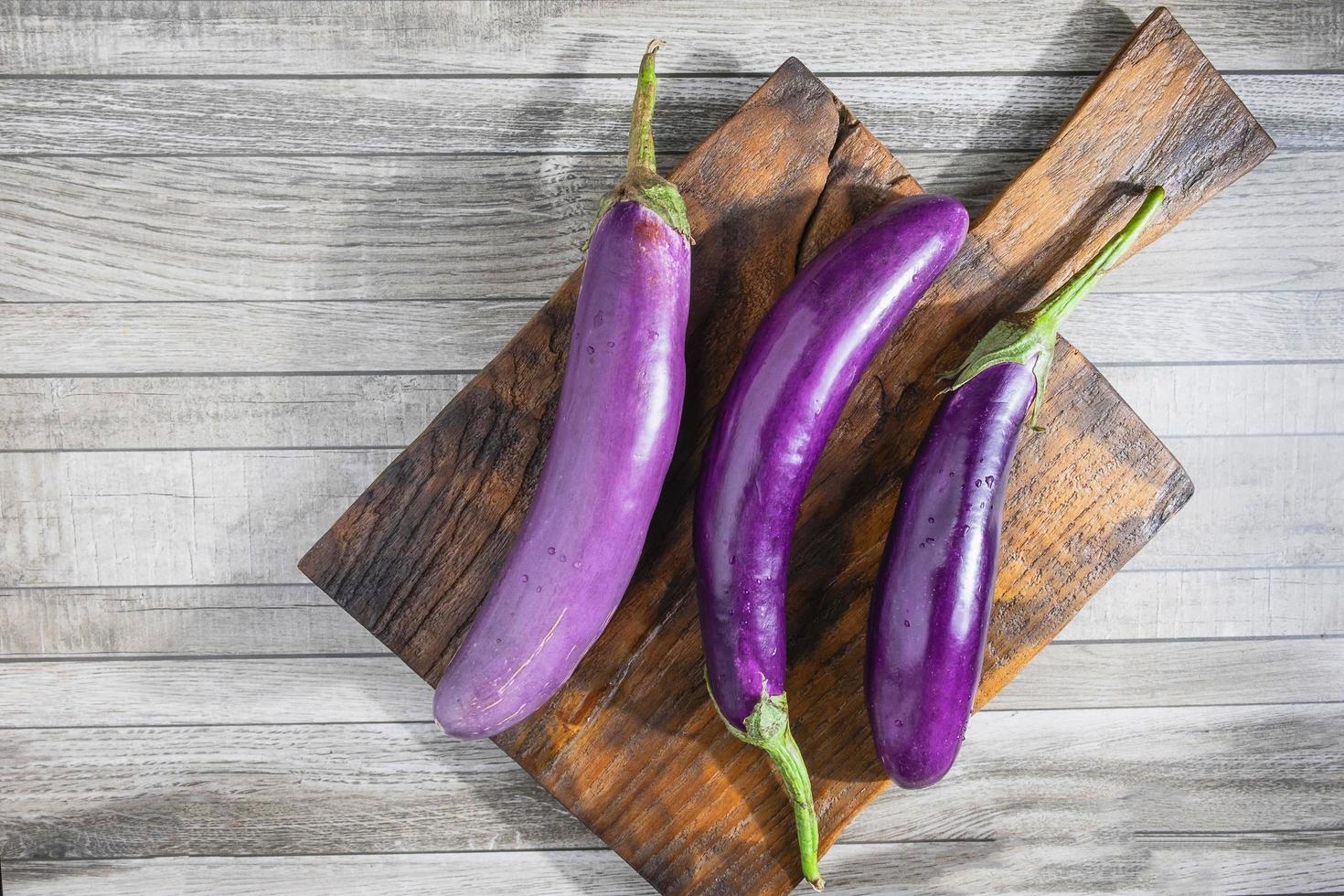 Eggplant on a cutting board photo