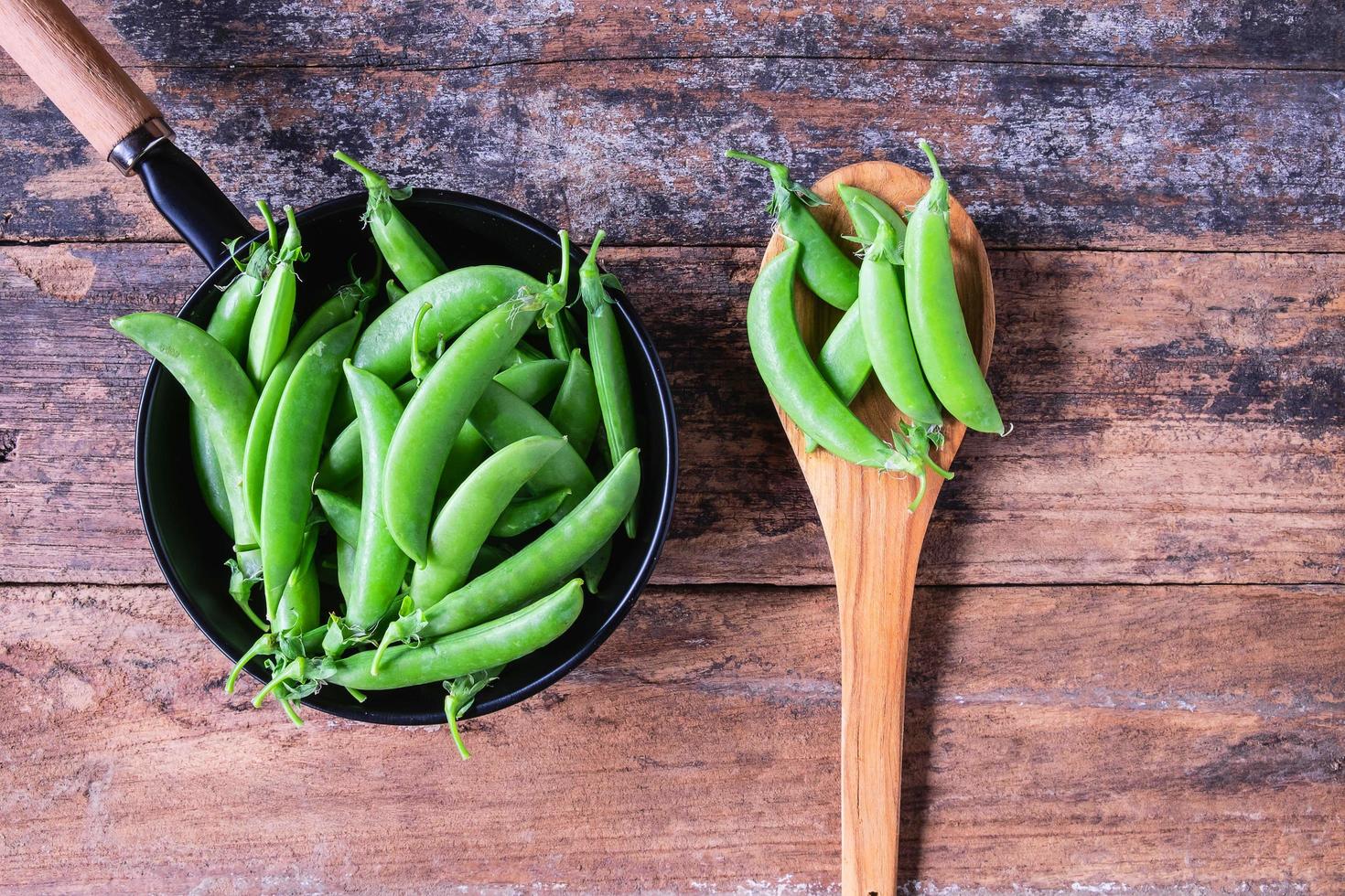 Fresh green peas in the pan. photo