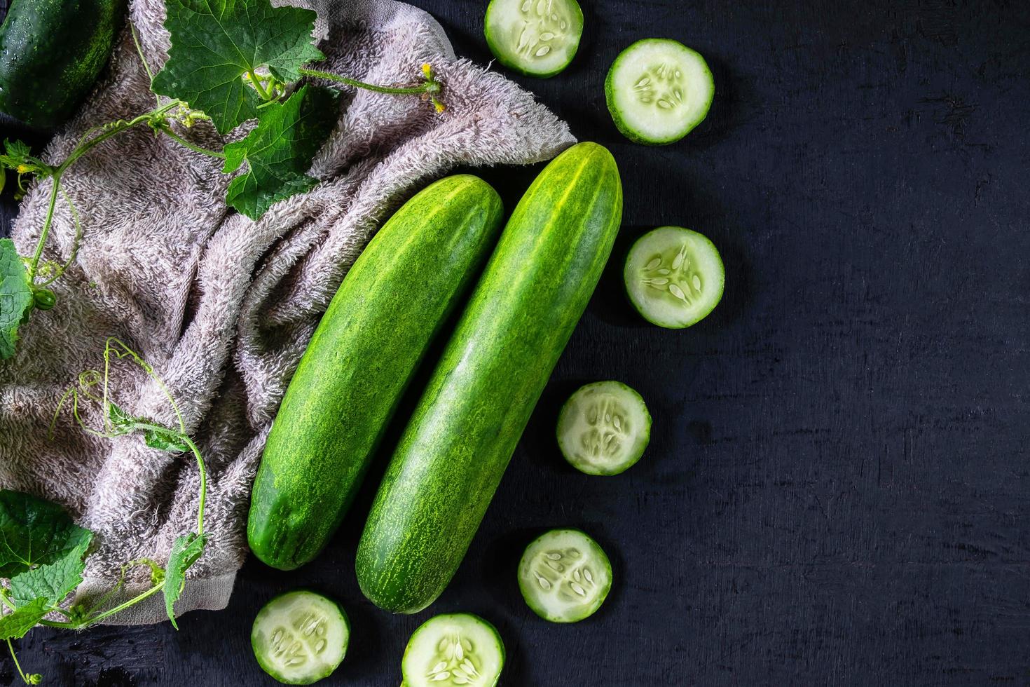 Chopped cucumbers on a towel photo