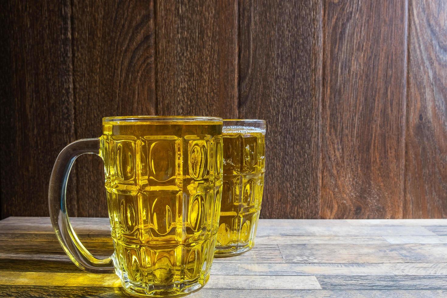 Two glass mugs with beer photo