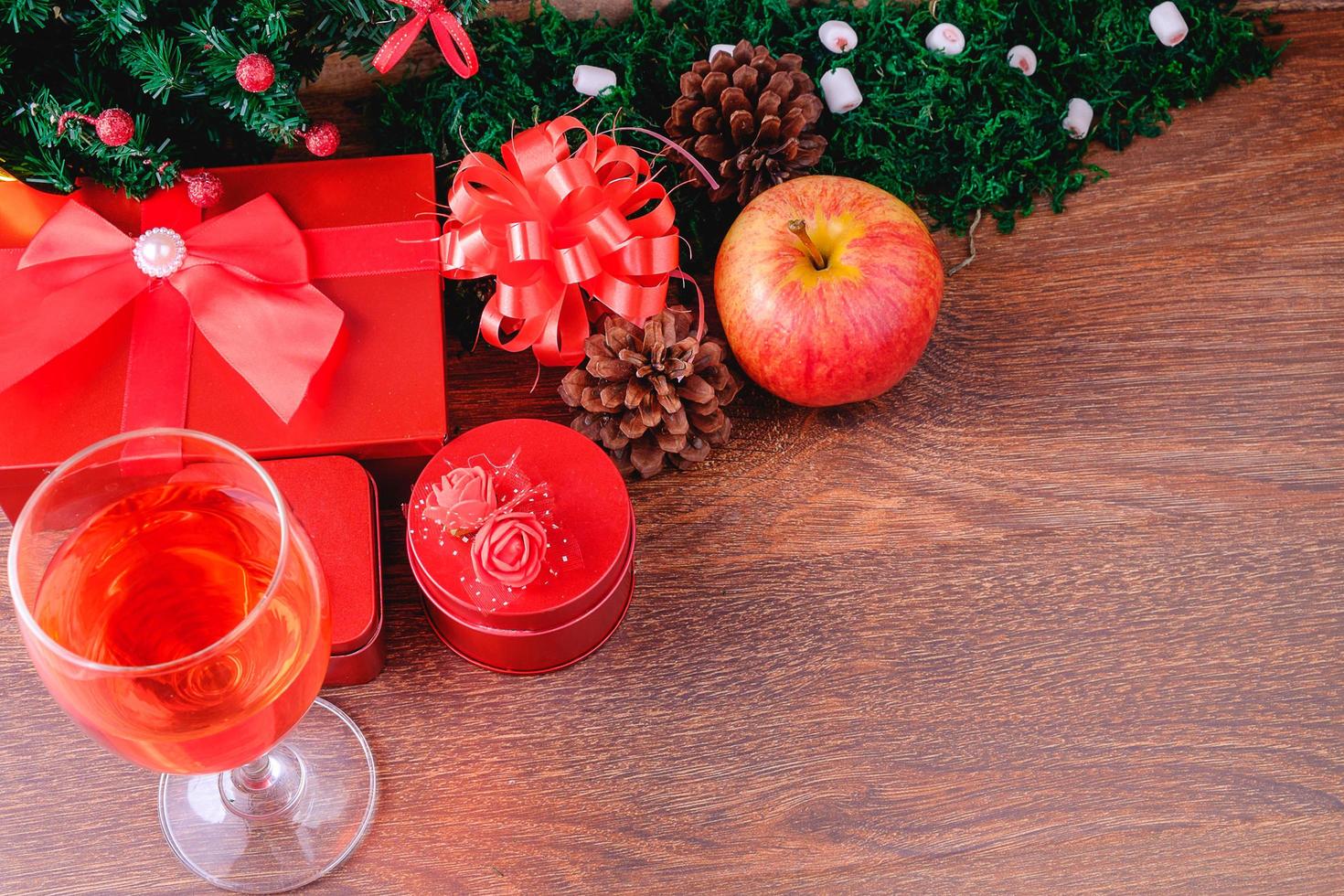 Wine glass and gift boxes at Christmas photo