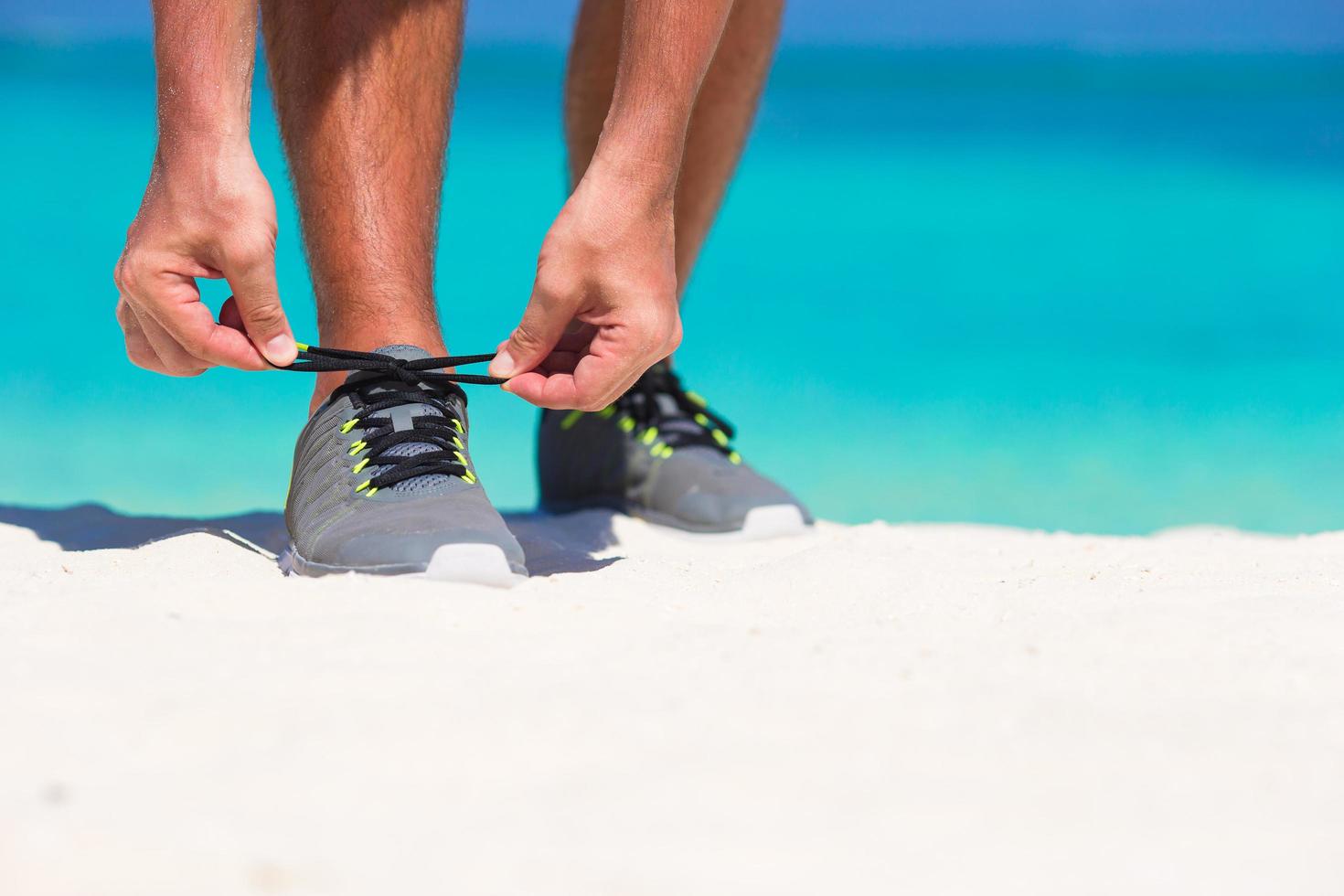 Close-up of a person tying shoes photo