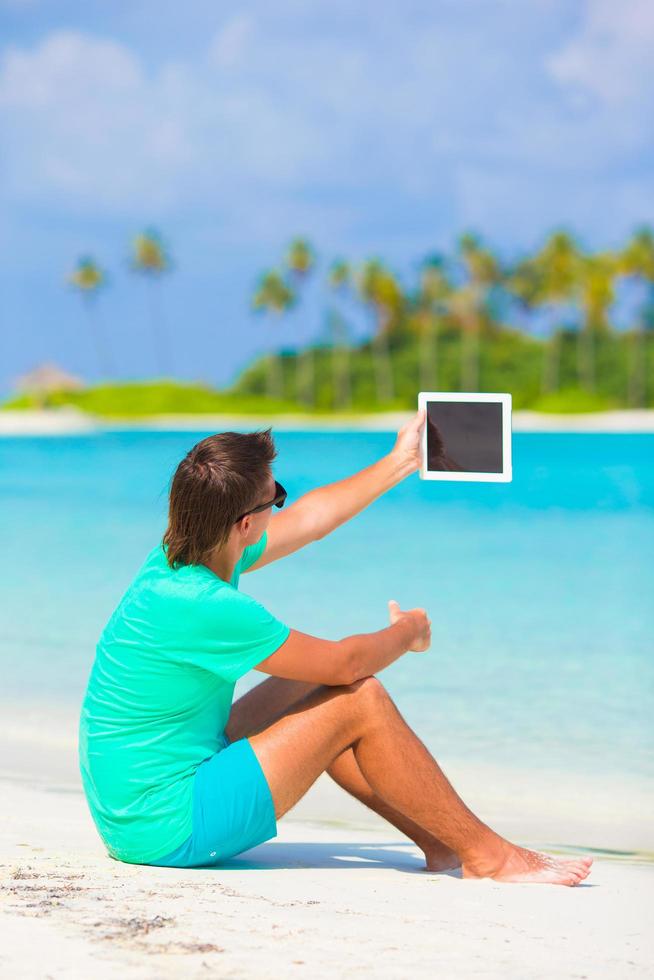 Man holding a tablet photo