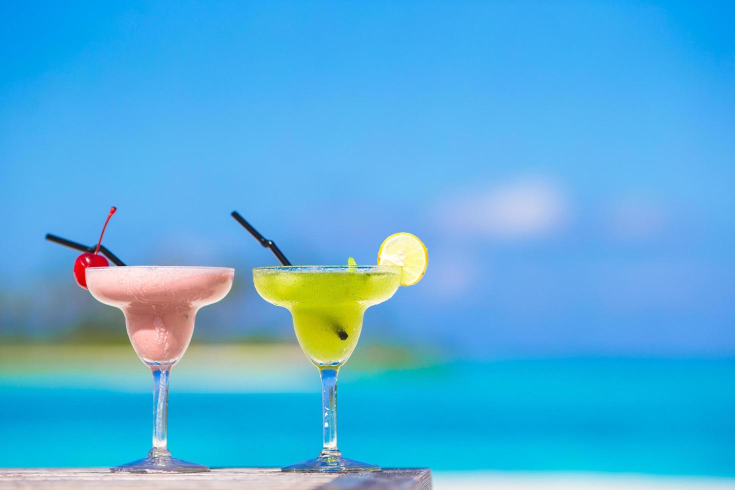 Two cocktails on a tropical white beach photo