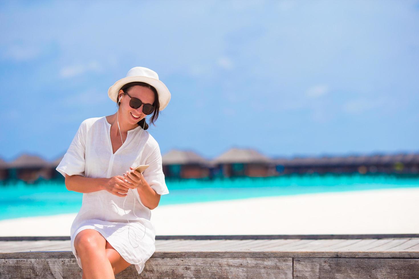 Woman relaxing with her phone photo