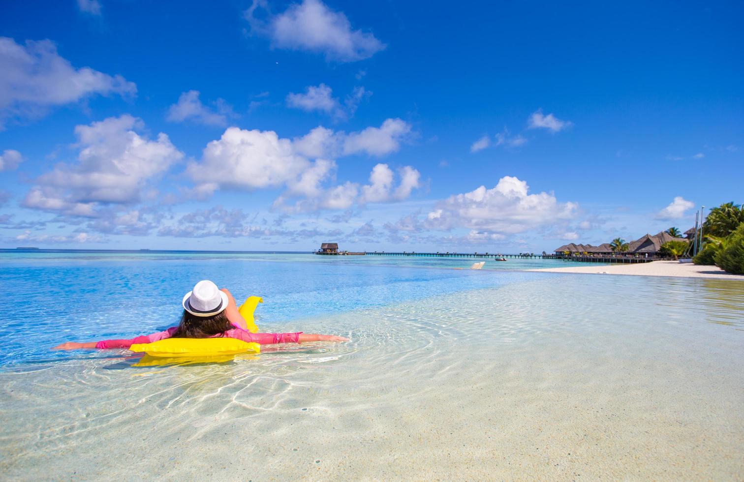 Woman relaxing on a floatie photo