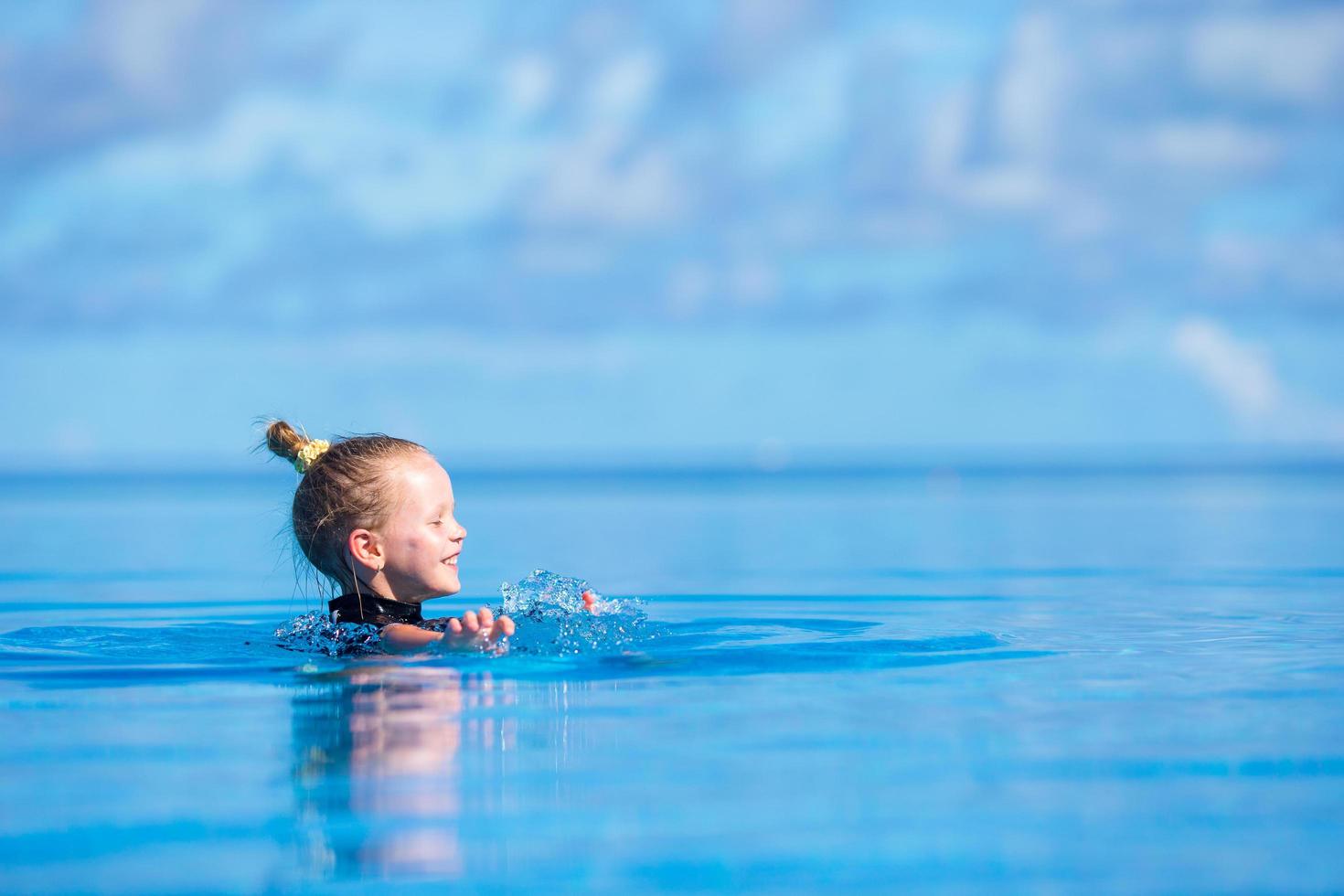 Girl swimming in the water photo