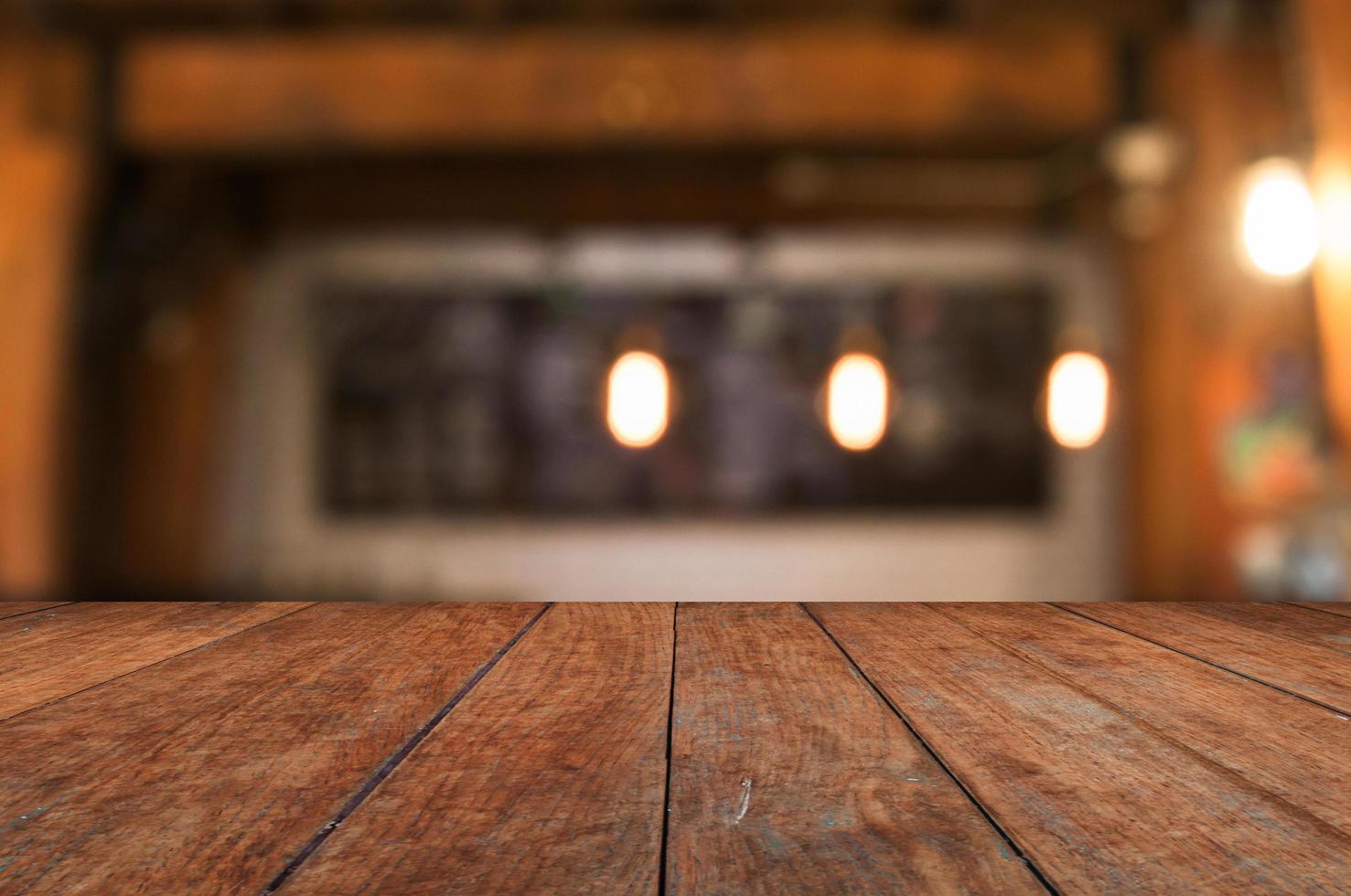 Wooden table top with rustic interior background photo