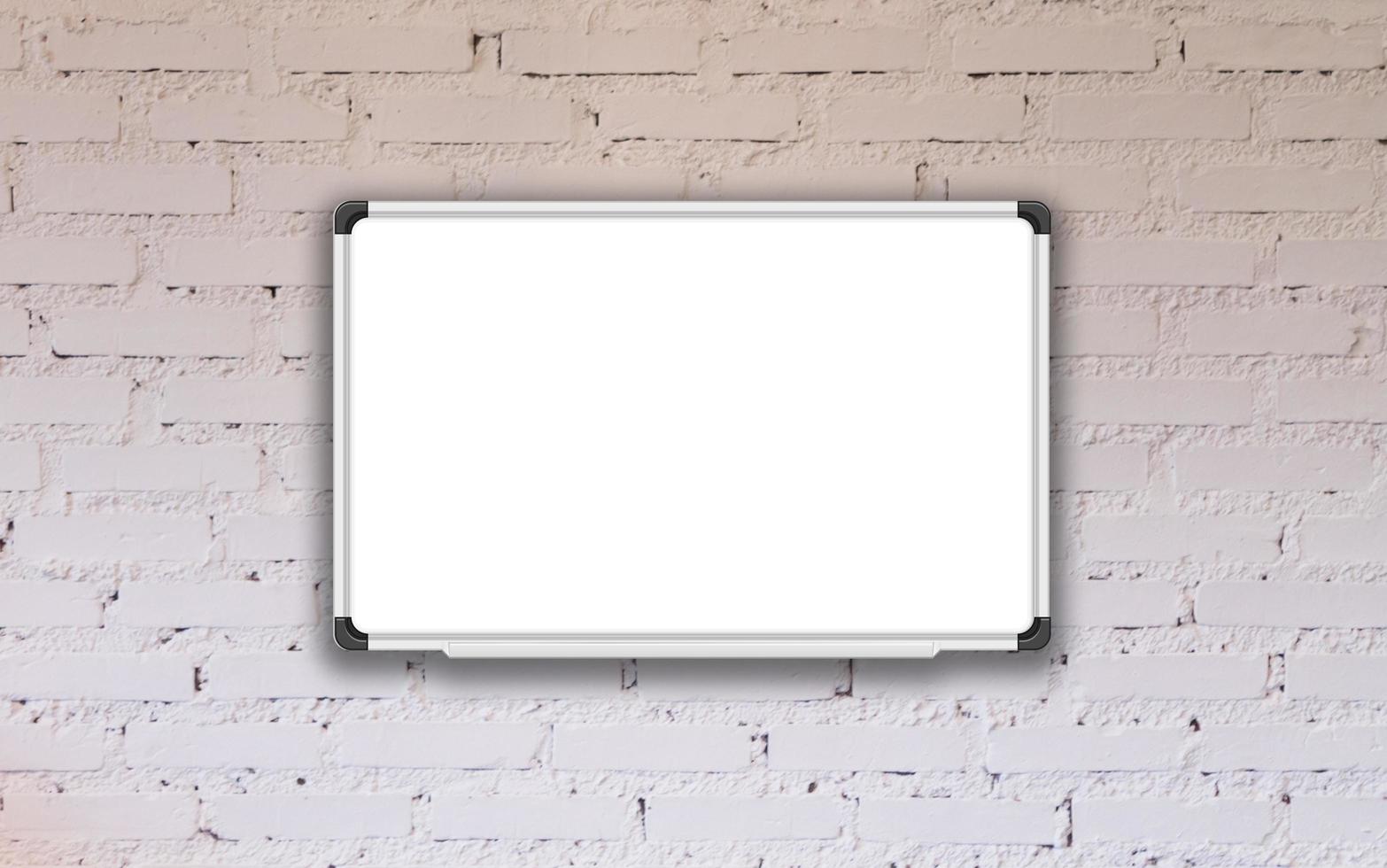 White board mock-up on white brick wall photo