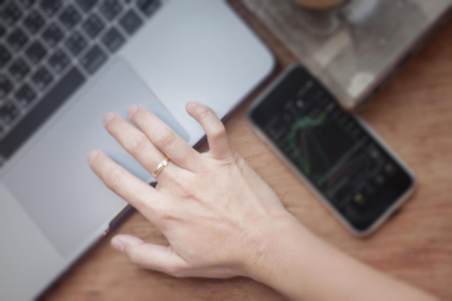 Close-up of a woman working on computer in coffee shop photo