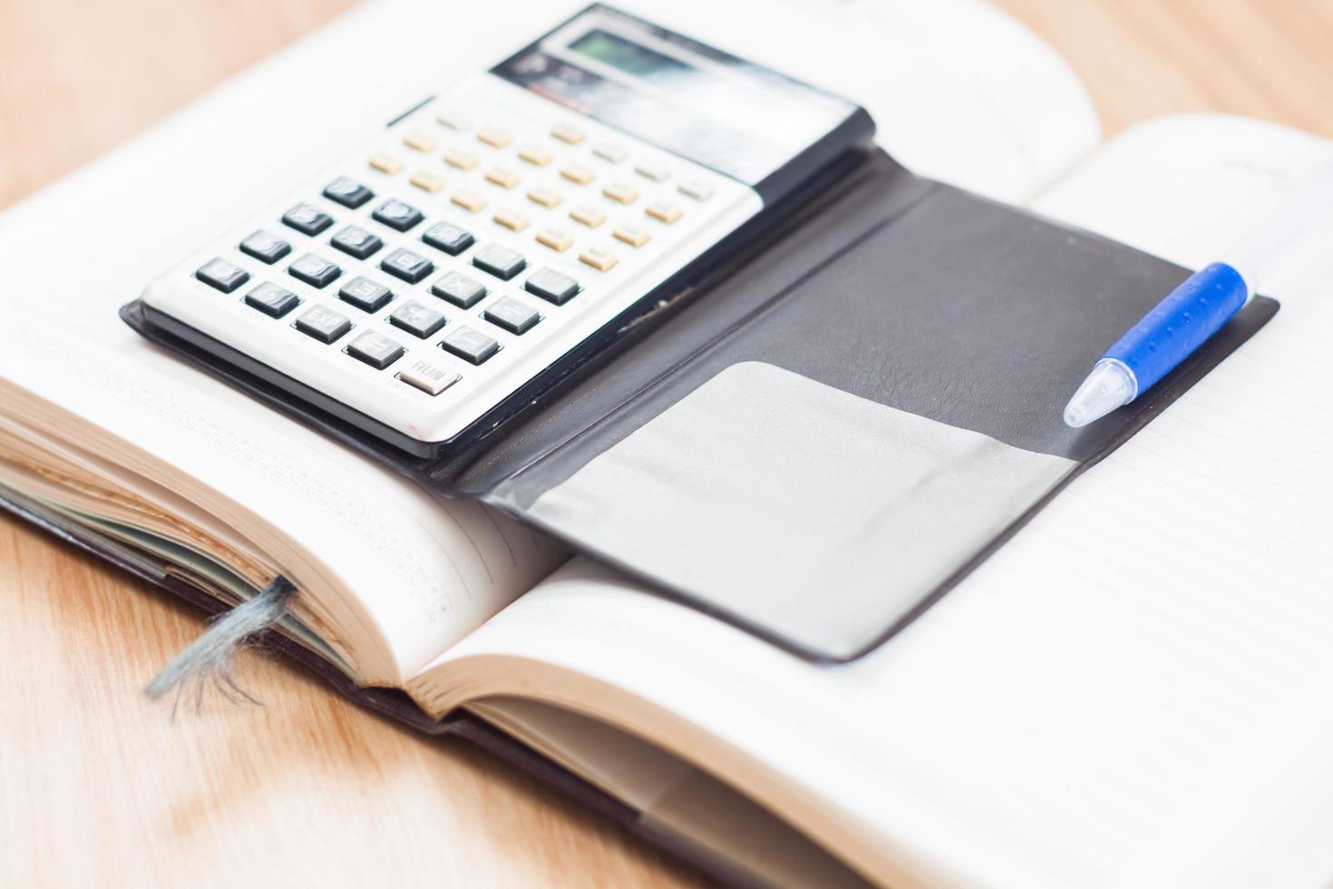 Calculator on an open notebook photo