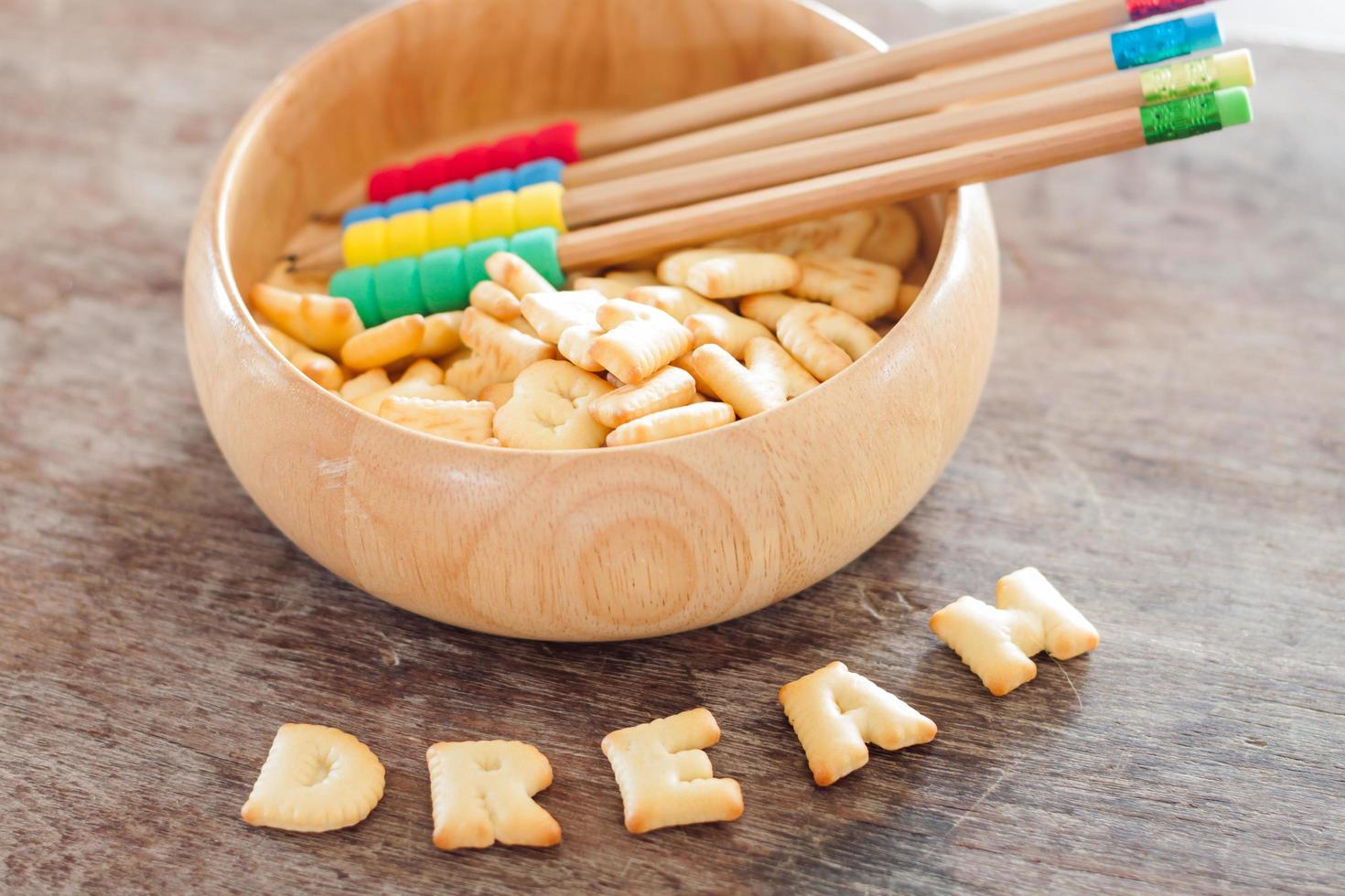 Dream alphabet biscuit on wooden table photo