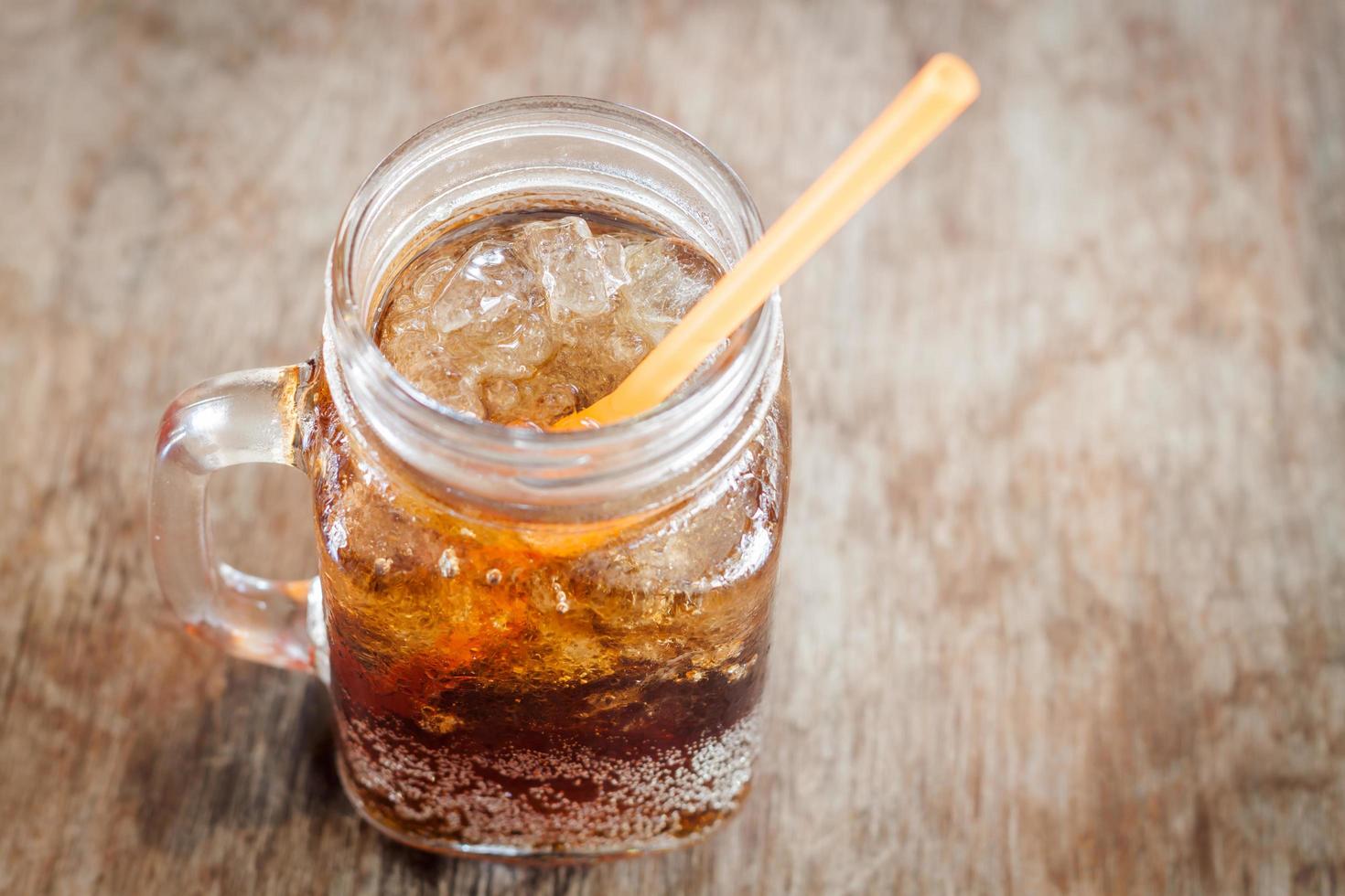 iced cola in a glass jar photo