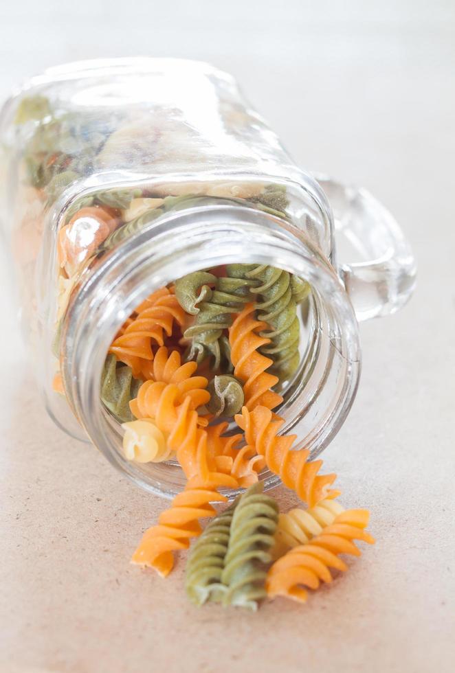 Pasta with a glass bottle photo