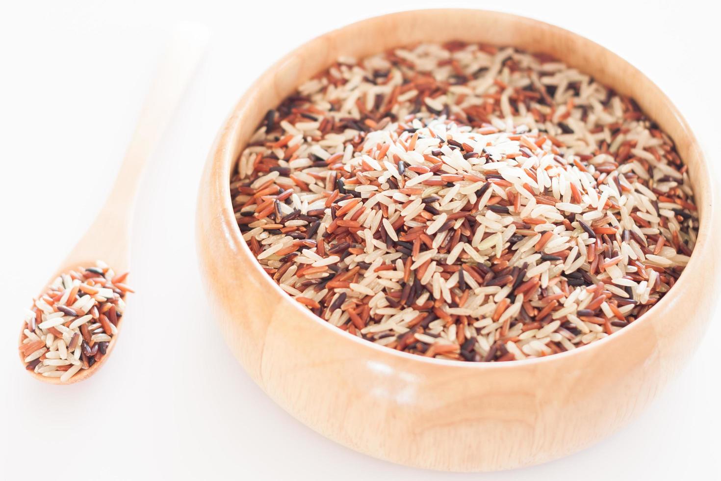 Organic dry multi-grain rice in a wooden bowl photo