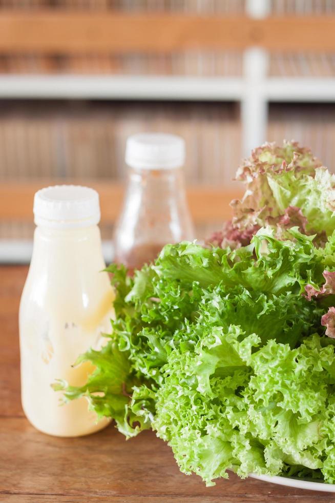 Veggies and salad dressing photo