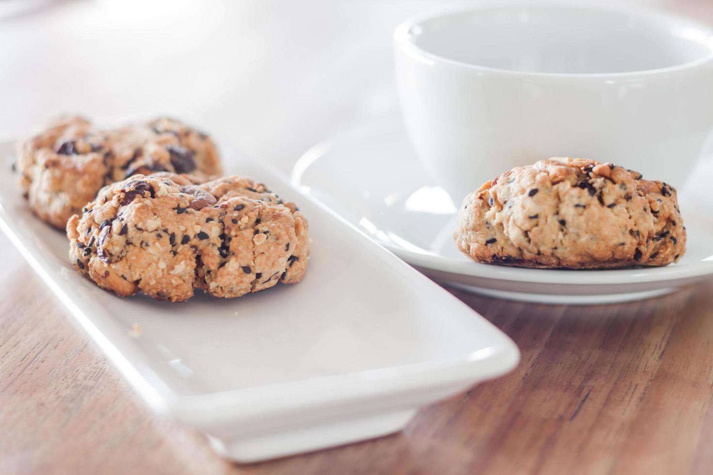 Coffee cup and mixed nut cookies photo