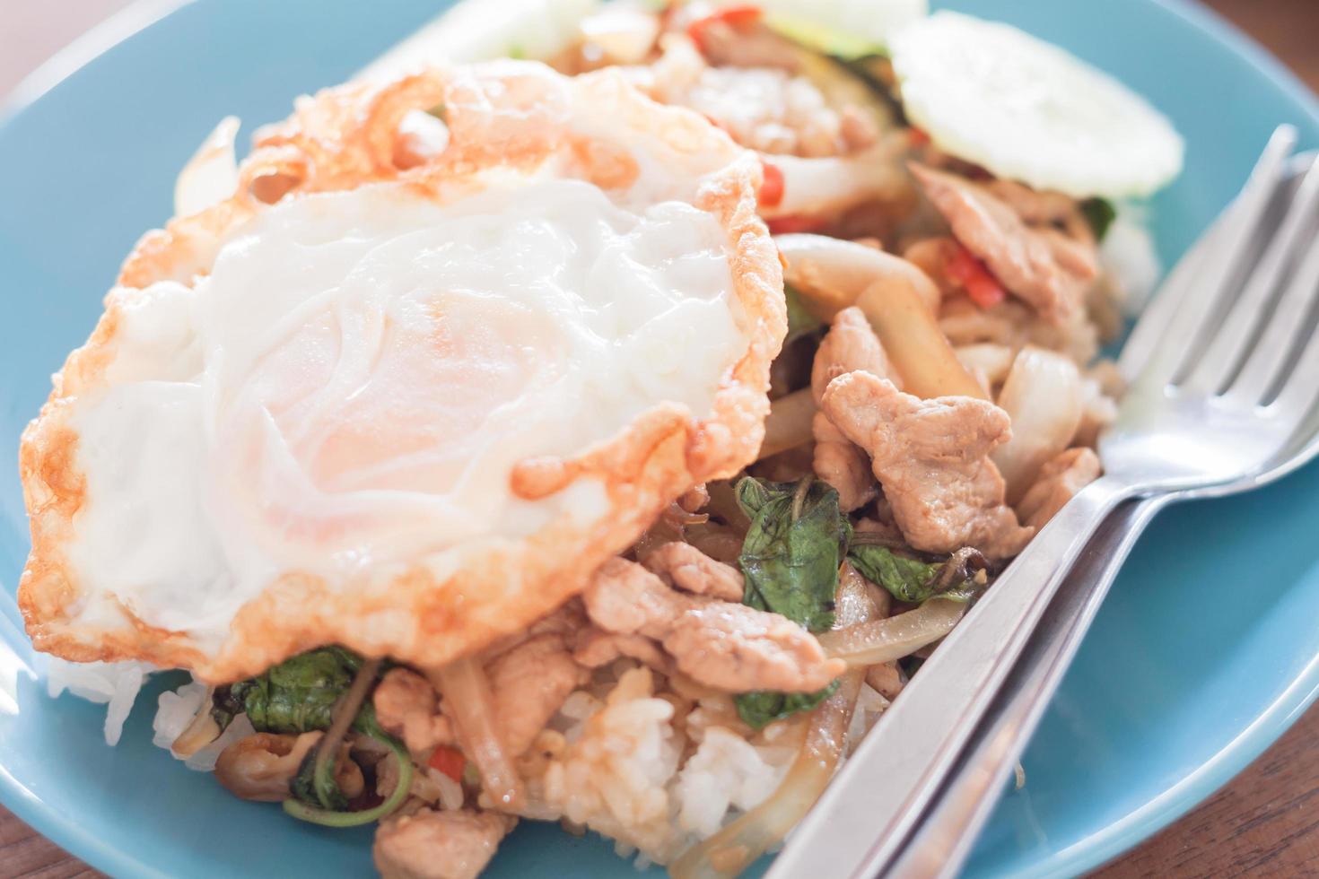 Basil fried rice with pork and a fried egg photo