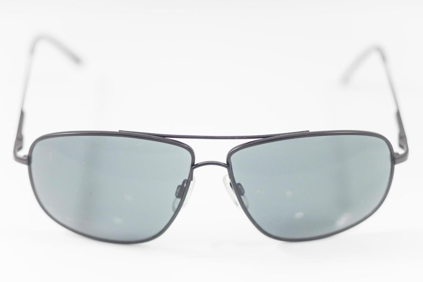 Black sunglasses on a white background photo