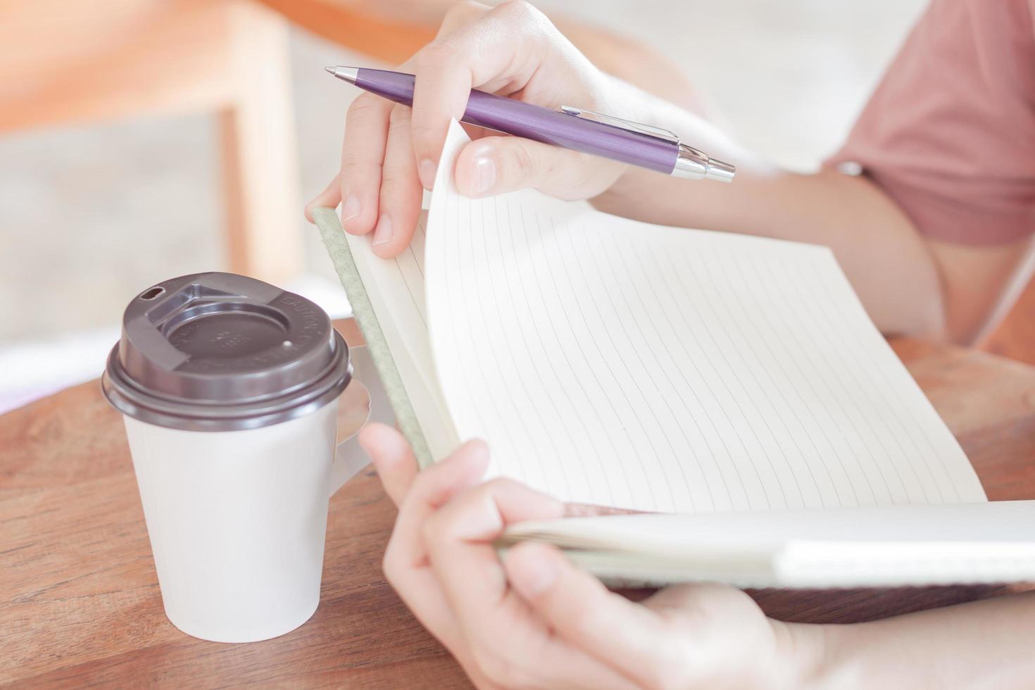 Close-up of a person working in a coffee house photo