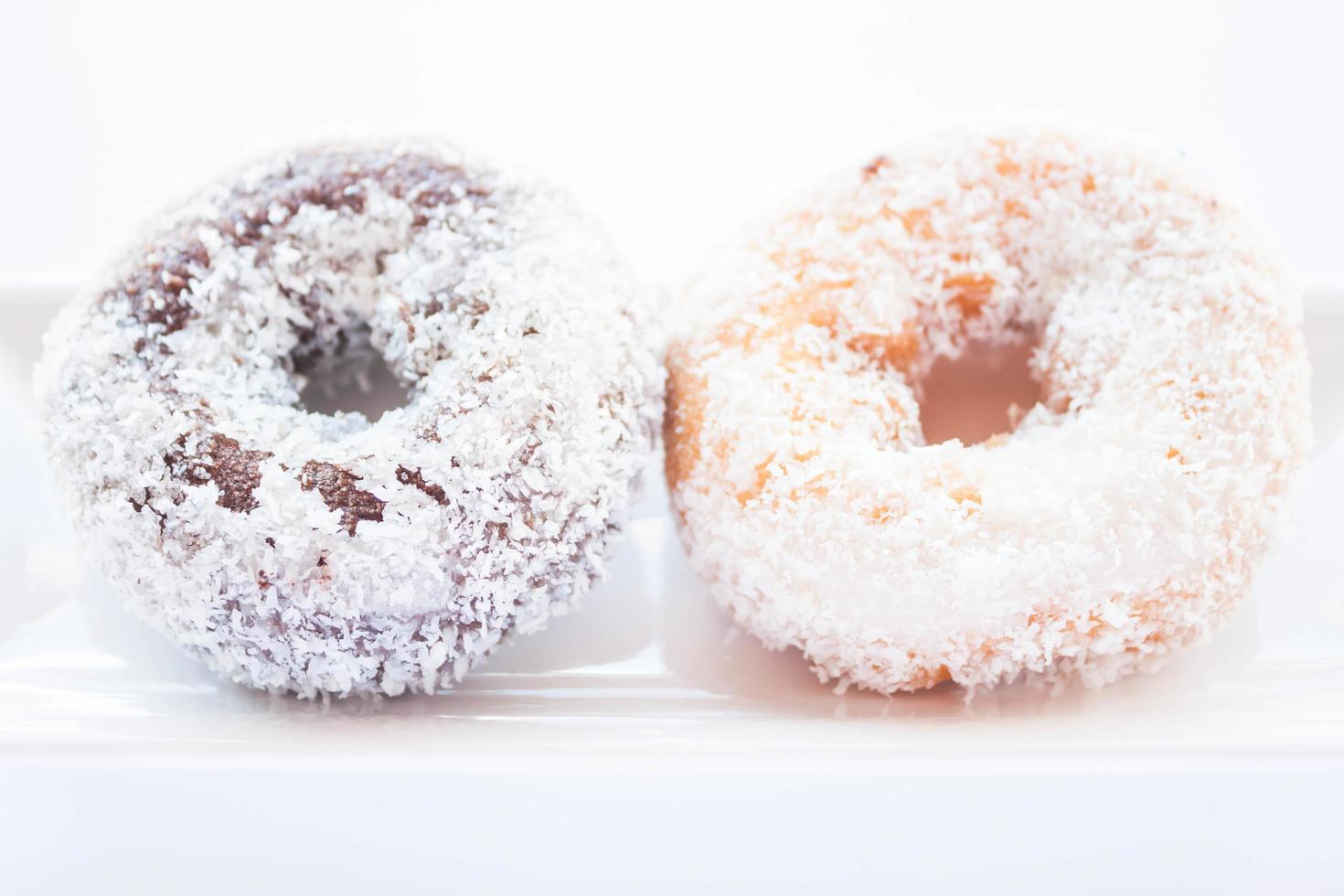 Chocolate and vanilla coconut donuts photo