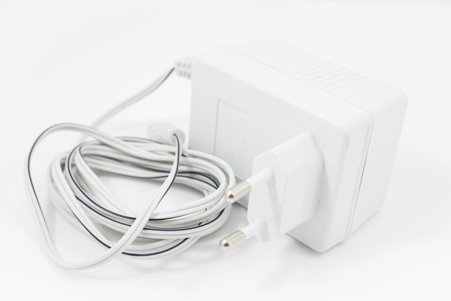 White power adapter on a white background photo