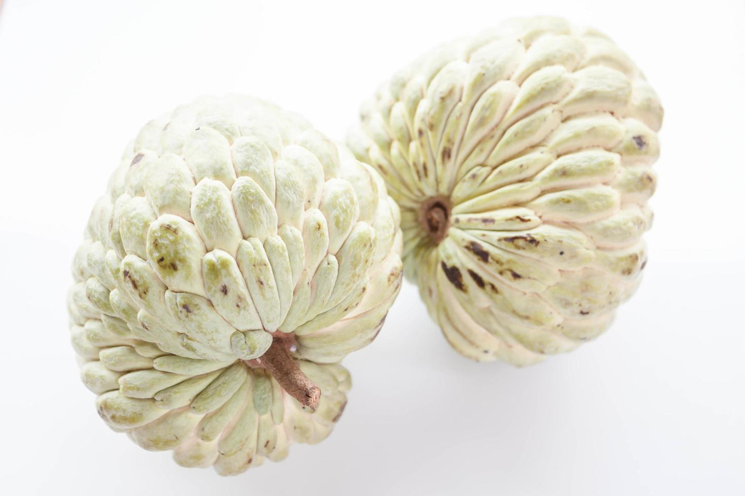 Two custard apples on a white background photo
