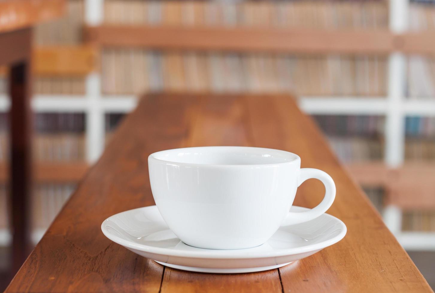 Coffee cup on a wooden counter photo