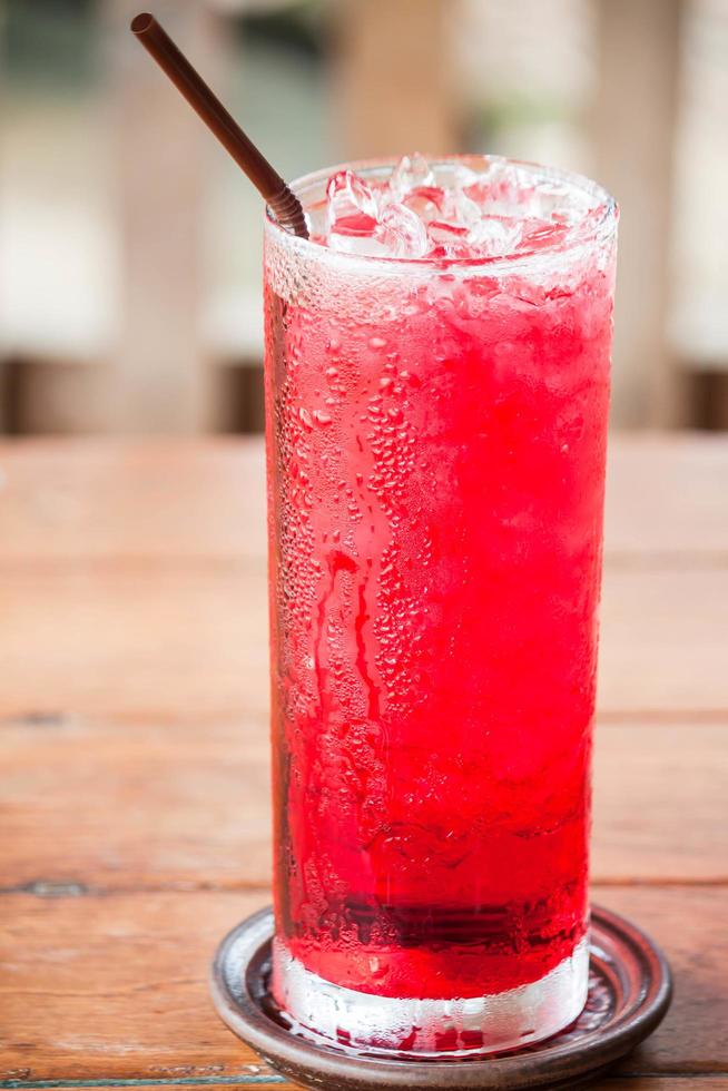 Iced red drink on a table photo