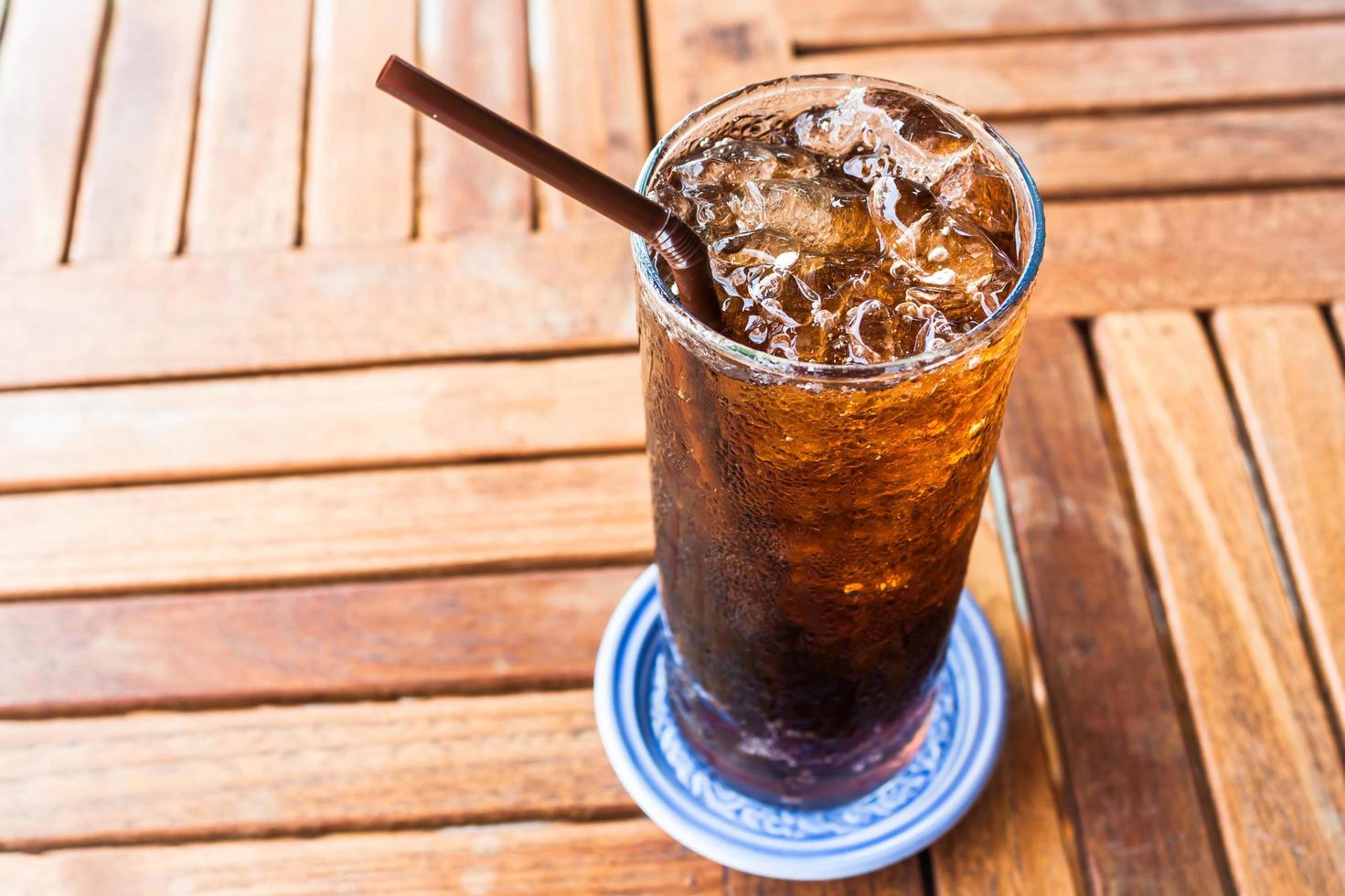 Iced soda on a wooden table photo