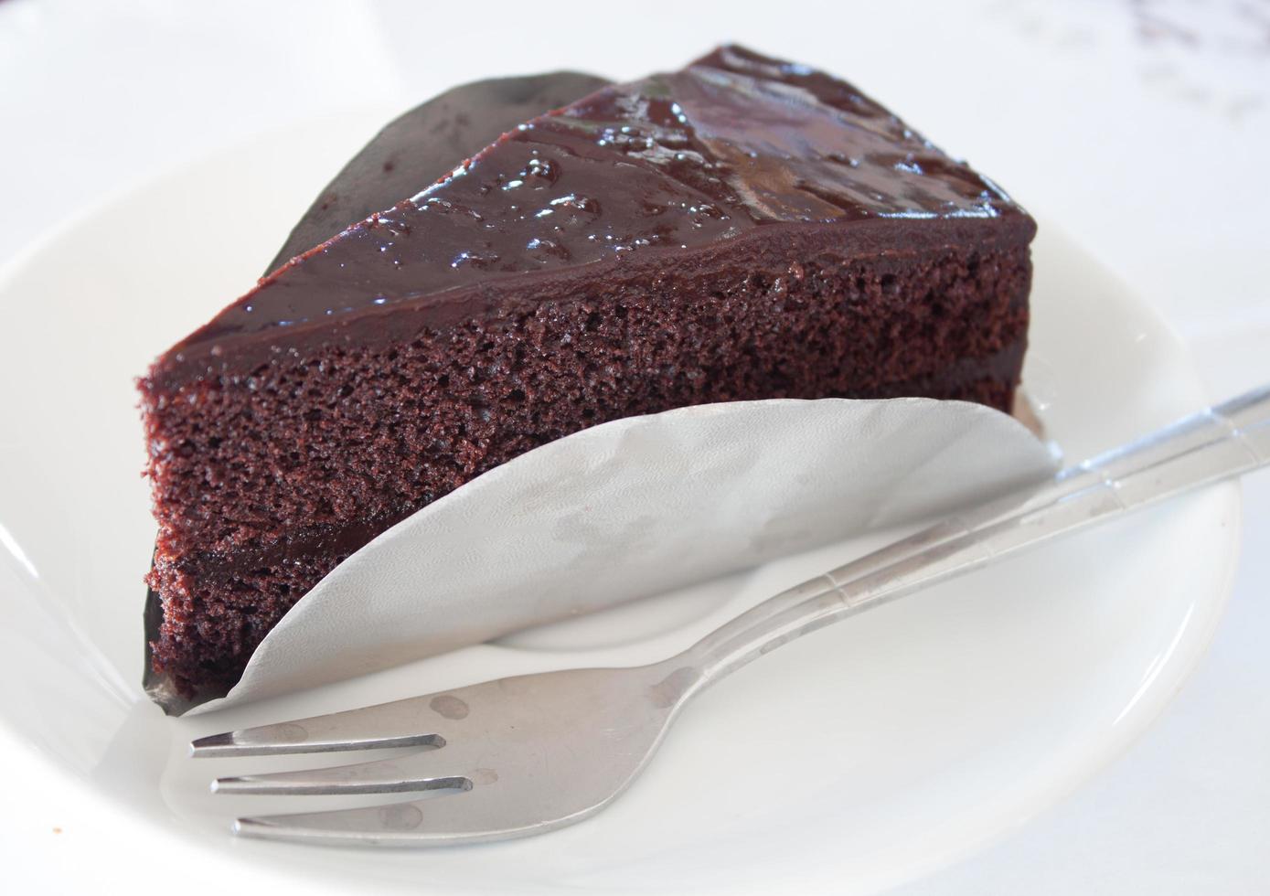 Piece of dark chocolate cake photo