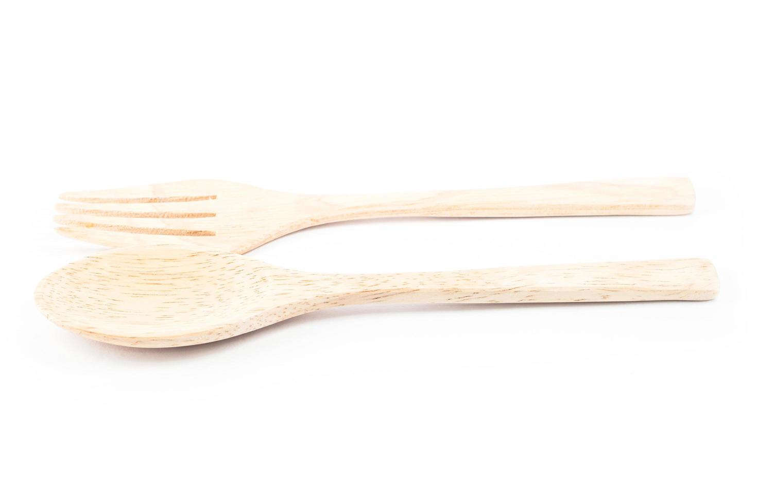 Wooden spoon and fork on a white background photo