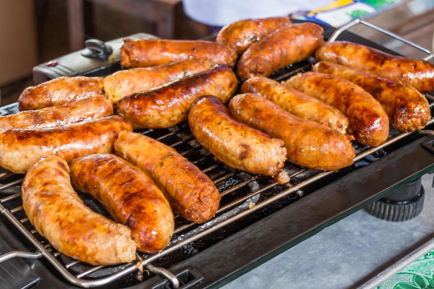 Sausages on a grill photo