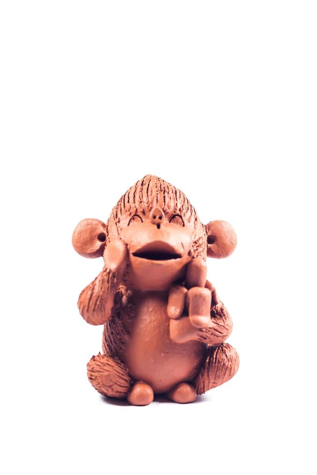 Close-up of a brown clay monkey photo