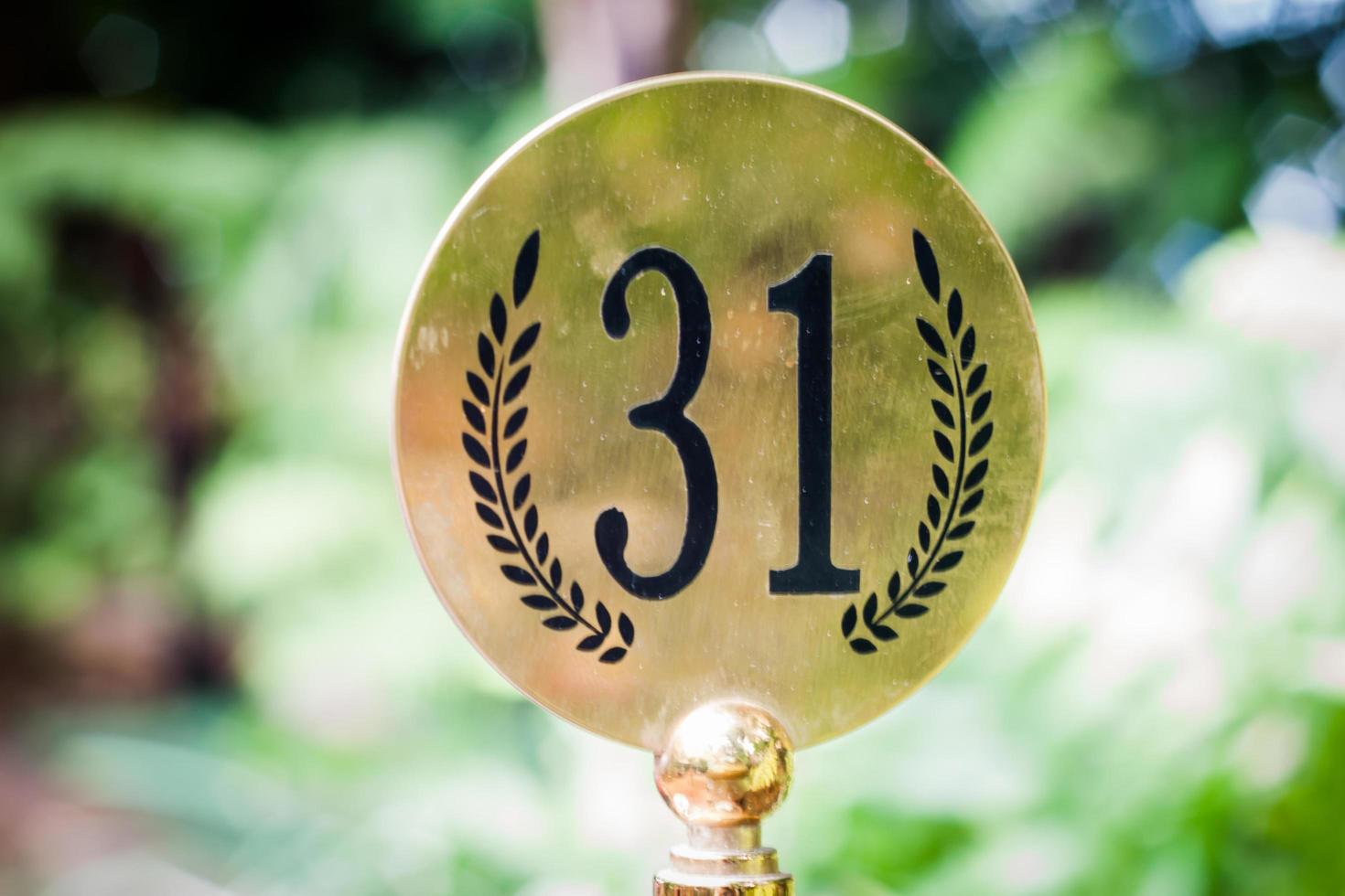 Close-up of a gold sign with 31 on it photo