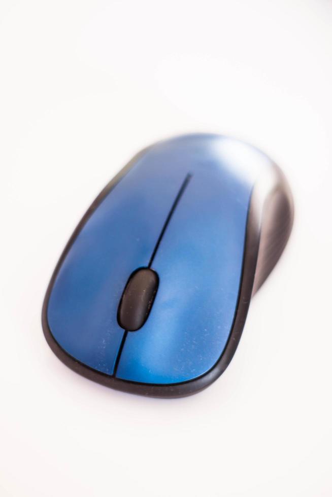 Blue wireless mouse on white background photo