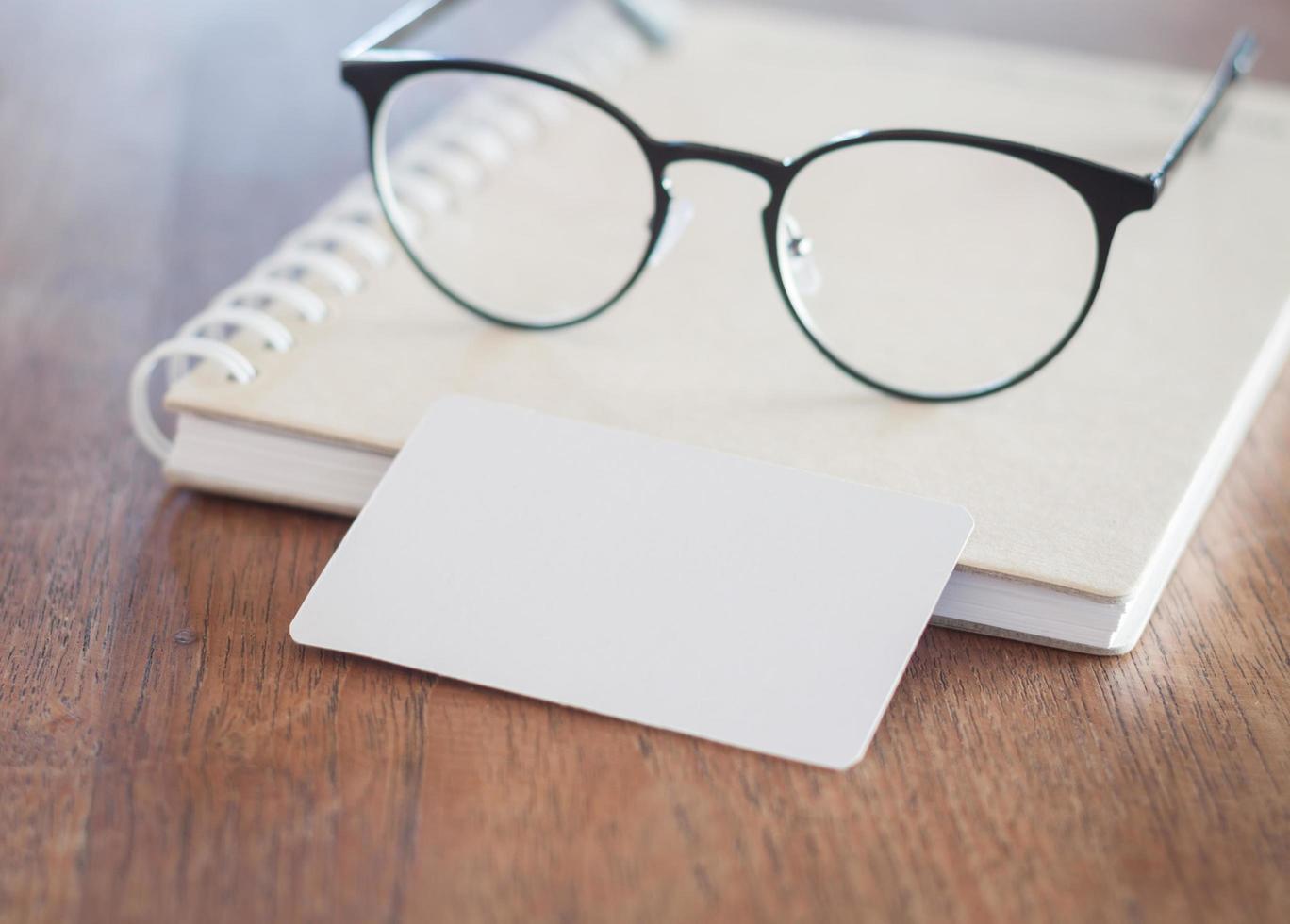 Pair of glasses with a blank business card photo