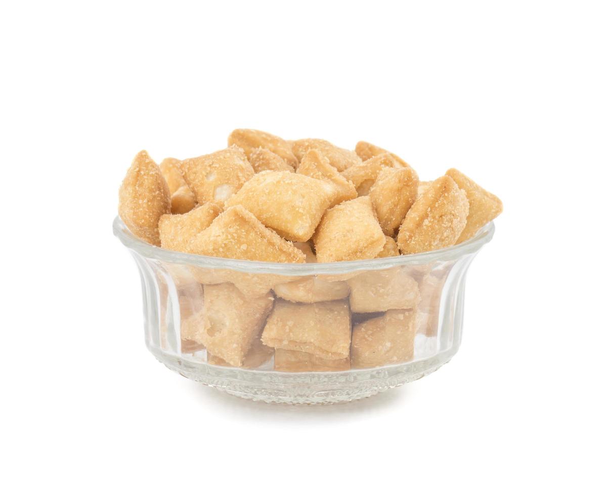 Shakkarpara snacks in a glass bowl photo