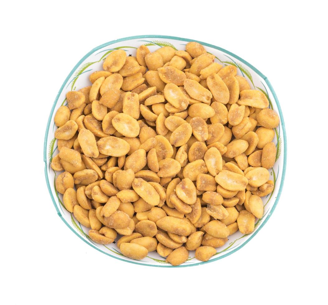 Top view of masala peanuts in a clear bowl photo