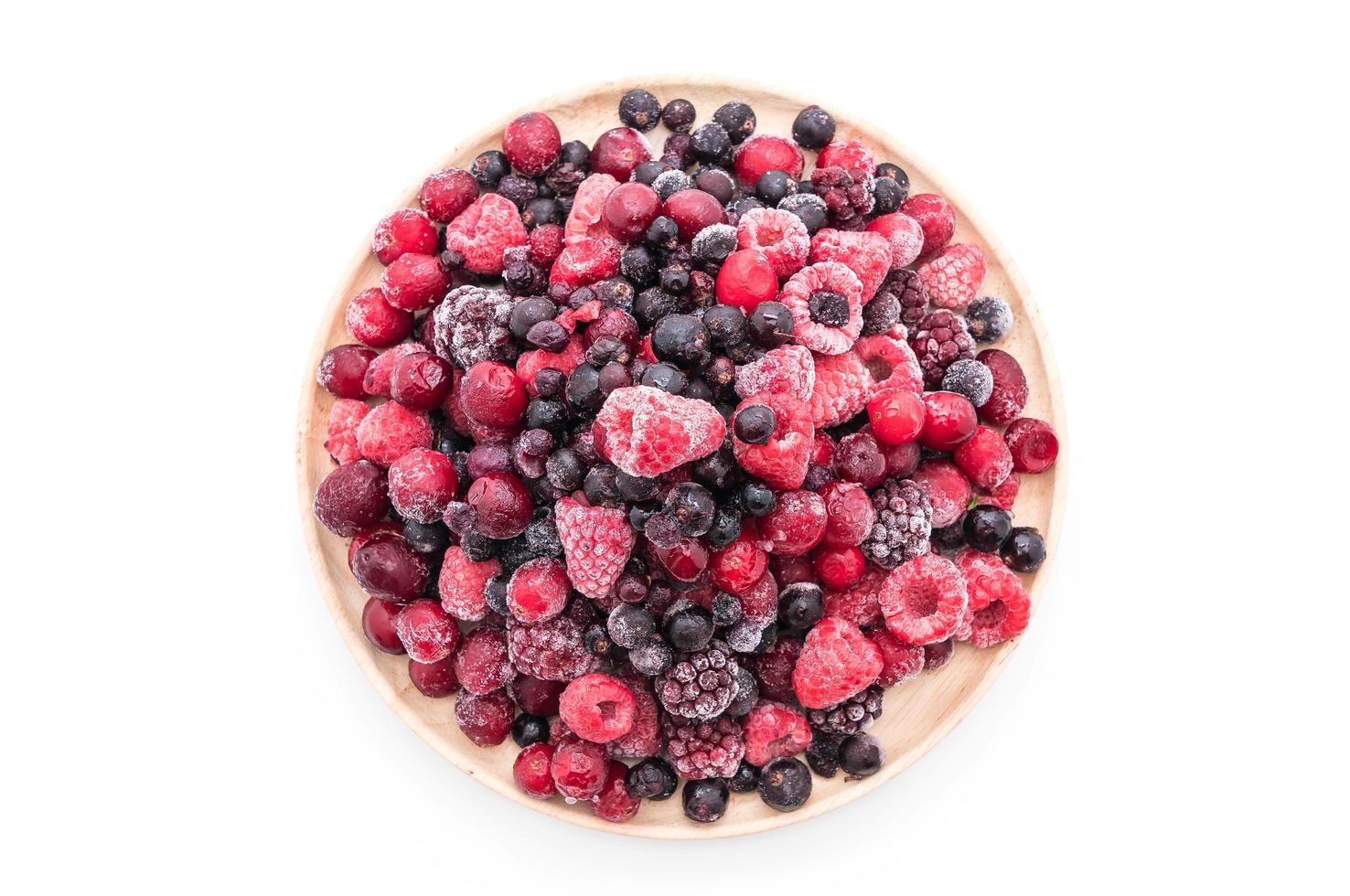 Frozen mixed berries on white background photo