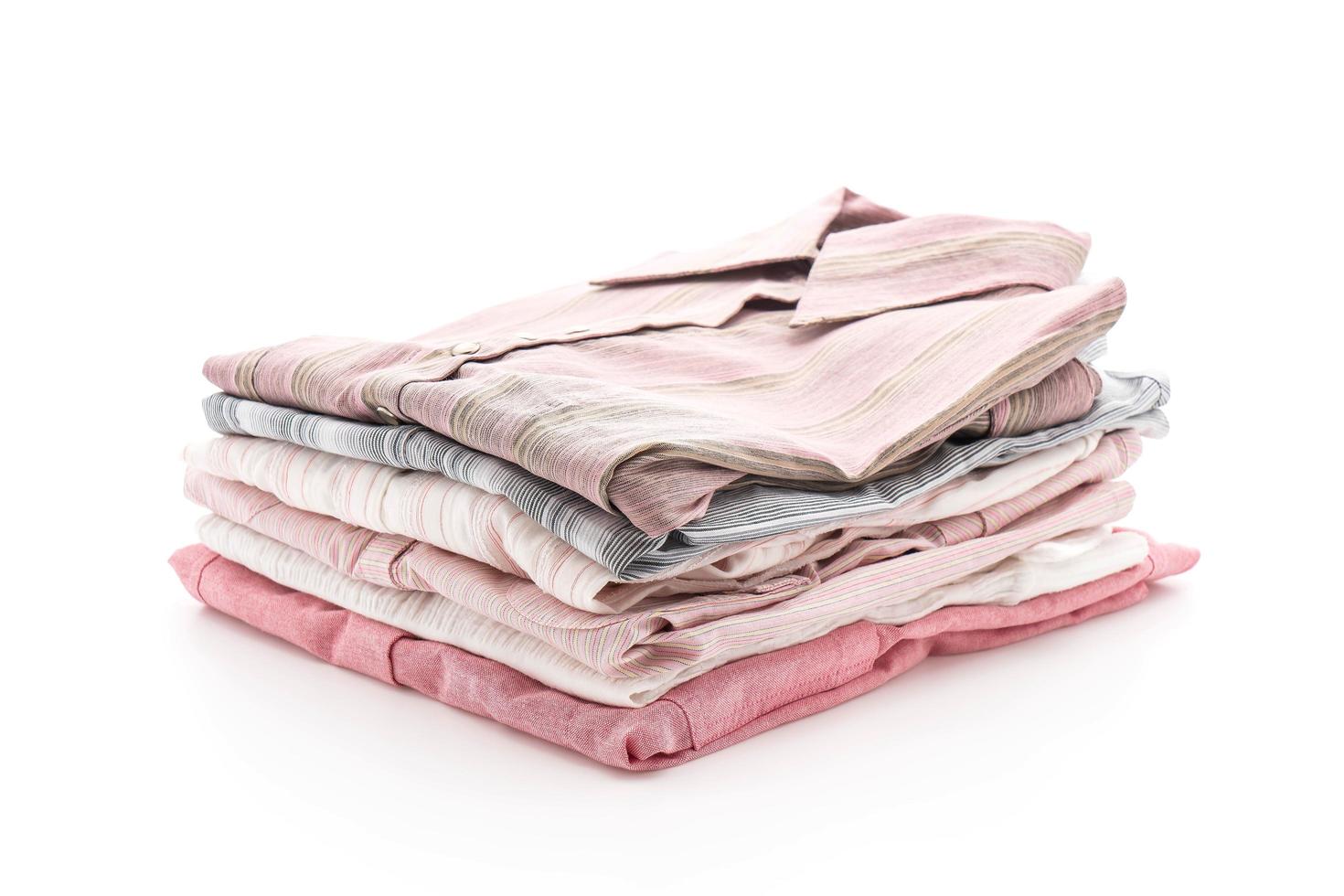 Folded garments on white background photo