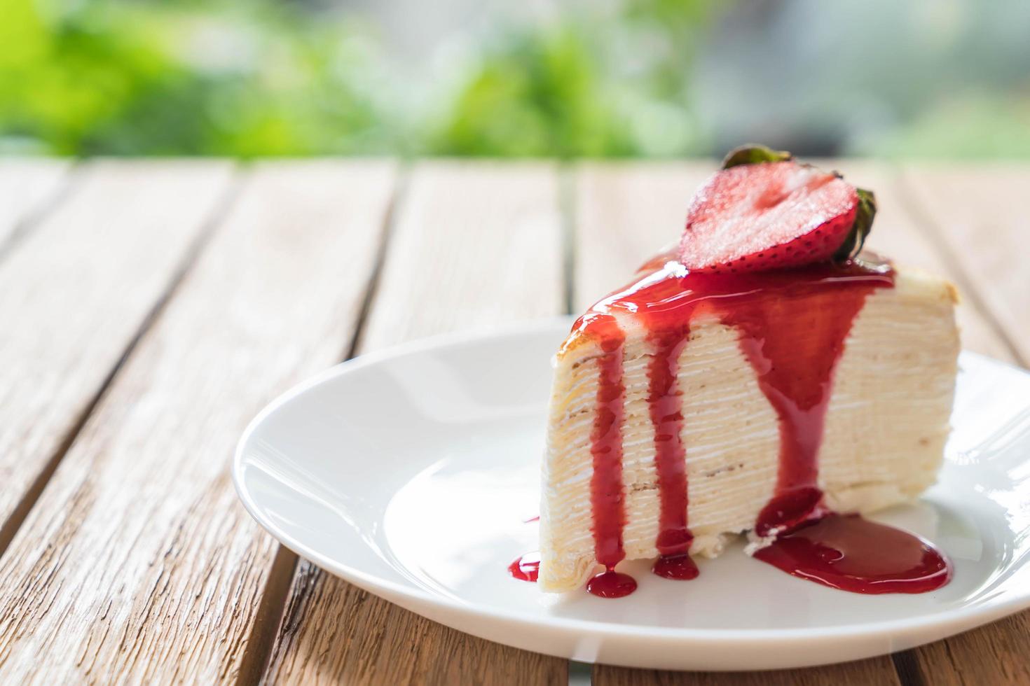 Vanilla crape cake with strawberry sauce photo