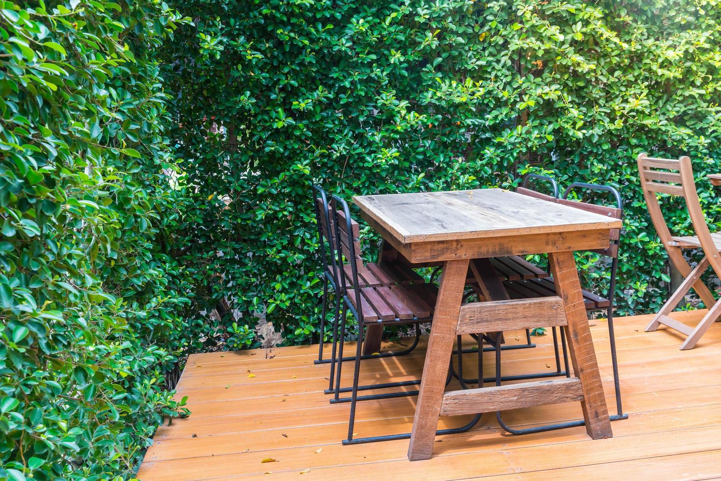 Empty wooden chairs and tables photo