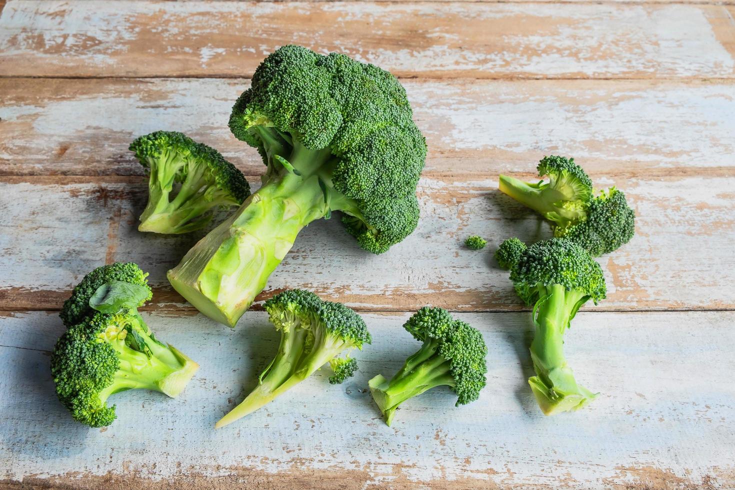 Cut broccoli on a table photo